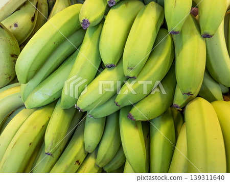 Fresh green and yellow bananas bunches at farmers market display 139311640