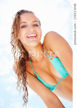 Summer, smile and bikini with portrait of woman on blue sky for swimming, relax and travel vacation. Tropical, happy and holiday with face of person and low angle for outdoor peace and swimwear 139311646