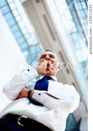 Businessman, thinking and low angle with idea for future, planning and success. Corporate, person or manager with smile in excitement of vision in modern office with formal fashion for profession Businessman, thinking and low angle with idea for future, planning and success. Corporate, person or manager with smile in excitement of vision in modern office with formal fashion for profession 139311832