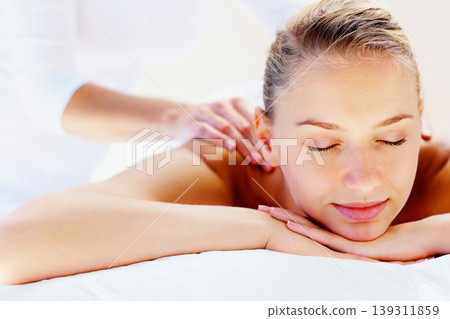 Vacation, massage and wellness with woman, luxury resort and health with body care, treatment and relax. Person, masseuse and girl on a weekend break, calm and holiday with peace and getaway trip Vacation, massage and wellness with woman, luxury resort and health with body care, treatment and relax. Person, masseuse and girl on a weekend break, calm and holiday with peace and getaway trip 139311859