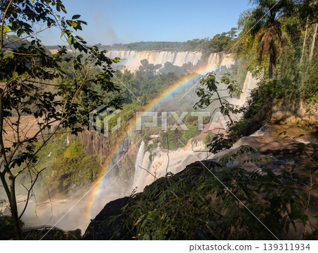 A rainbow appears on the water flowing from Iguazu Falls and the turbulent river in Iguazu National Park and Reserve in Argentina, June 139311934