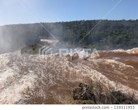 Aerial view of the water and rocks at Devil's Throat Falls in Iguazu National Park and Reserve in Argentina in June. Close-up 139311955