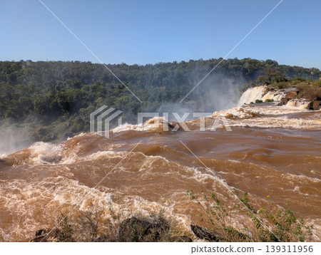 Mist from Devil's Throat Falls as seen from the water's edge in Iguazu National Park and Reserve in Argentina in June. Close-up 139311956