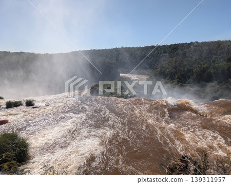 Mist from Devil's Throat Falls as seen from the water's edge in Iguazu National Park and Reserve in Argentina in June 139311957