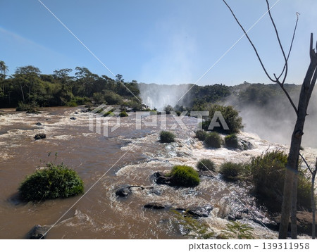Mist from Devil's Throat Falls as the water cascades over rocks in Iguazu National Park and Reserve in Argentina in June 139311958