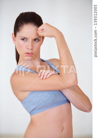 Woman, face or serious in studio with flex for fitness, wellness or workout strength with sportswear. Person, athlete or thinking for biceps, exercise or training on white background or mock up space Woman, face or serious in studio with flex for fitness, wellness or workout strength with sportswear. Person, athlete or thinking for biceps, exercise or training on white background or mock up space 139312005