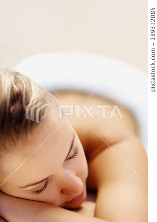 Woman, sleeping and rest on bed in spa for health, wellness and recovery with closeup, peace or quiet. Girl, space and tired at resort for rehabilitation, massage or physical therapy for body fatigue Woman, sleeping and rest on bed in spa for health, wellness and recovery with closeup, peace or quiet. Girl, space and tired at resort for rehabilitation, massage or physical therapy for body fatigue 139312085
