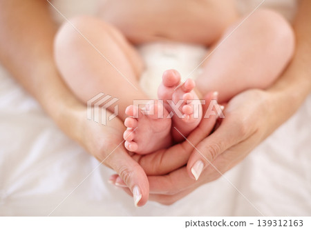 Woman, child and feet holding for love connection or childhood bonding, motherhood or newborn. Female person, infant and toes or care support for kid growth development, parent trust or nurture youth Woman, child and feet holding for love connection or childhood bonding, motherhood or newborn. Female person, infant and toes or care support for kid growth development, parent trust or nurture youth 139312163