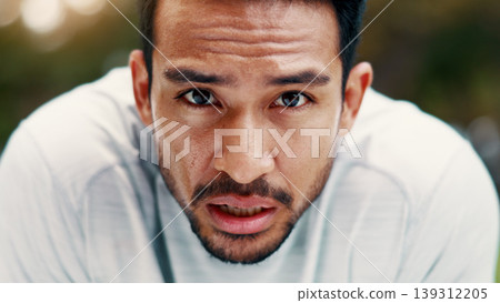 Man, sweat and portrait for fitness at park, serious and exhausted with fatigue on break. Person, runner and outdoor with nature for exercise, cardio challenge and burnout for wellness in Cambodia 139312205