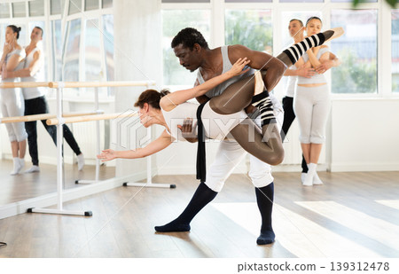 Adult man and adult woman rehearsing pair ballet Adult man and adult woman rehearsing pair ballet 139312478