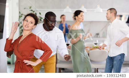 Friends man and woman dancing active dance Friends man and woman dancing active dance 139312483