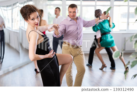 Man and woman practicing swing dance in dancing studio Man and woman practicing swing dance in dancing studio 139312490