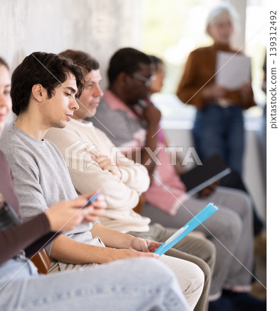 People are sitting in line and waiting for an interview 139312492