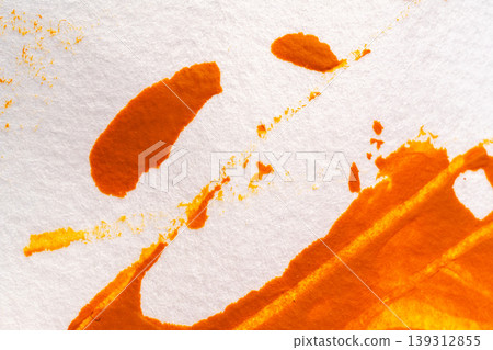 A background image of orange paint smeared on white paper. A background image of orange paint smeared on white paper. 139312855