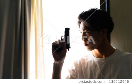 A man with a gun 139312946