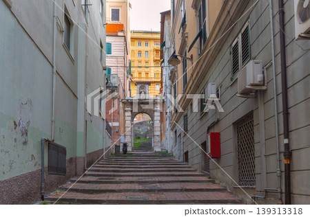Narrow street with stairs and archway in Genoa Italy 139313318