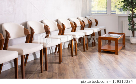 Rows of chairs in empty reception space Rows of chairs in empty reception space 139313384