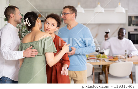 Group of friends greeting each other Group of friends greeting each other 139313402