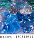 A fantastically shimmering blue light bokeh and an abstract, underwater-like background. 139313614
