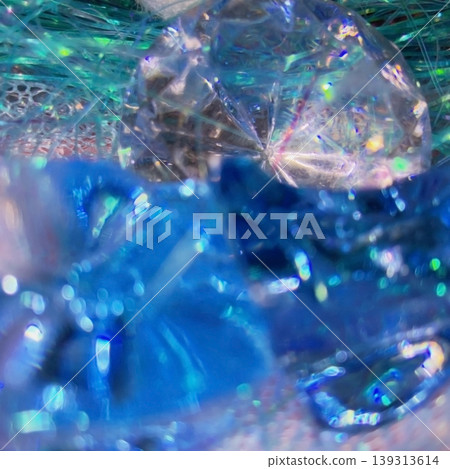 A fantastically shimmering blue light bokeh and an abstract, underwater-like background. A fantastically shimmering blue light bokeh and an abstract, underwater-like background. 139313614