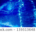 A fantastically shimmering blue light bokeh and an abstract, sparkling background. 139313648