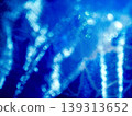A fantastically shimmering blue light bokeh and an abstract, sparkling background. 139313652