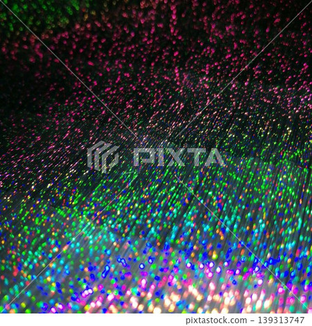 An abstract background with fantastically shimmering rainbow-colored holograms and flowing particles of light. 139313747
