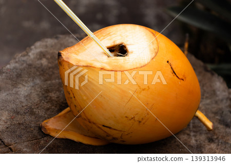 King Coconut with a straw inside King Coconut with a straw inside 139313946