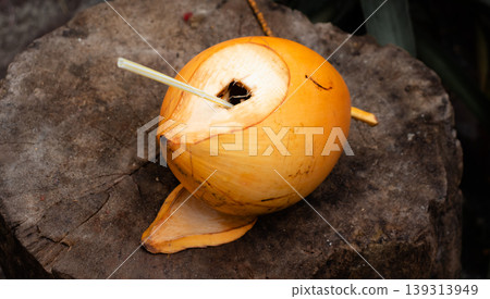 King Coconut with a straw inside King Coconut with a straw inside 139313949