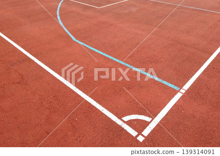 Close-up of white marking lines of outdoor basketball court. 139314091