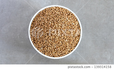 Coriander Seeds Bowl Top View Neutral background with negative space to add captions 139314158