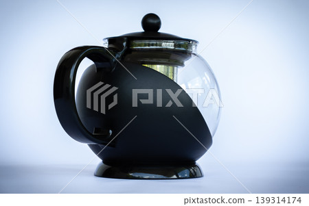 Black glass coffee pot in neutral background angled side view Black glass coffee pot in neutral background angled side view 139314174