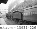 A passenger train on the Gotemba Line, pulled by a D52 locomotive, departing from Kōzu Station. 139314226