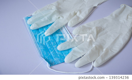 Medical face mask and pair of latex medical gloves Medical face mask and pair of latex medical gloves 139314236