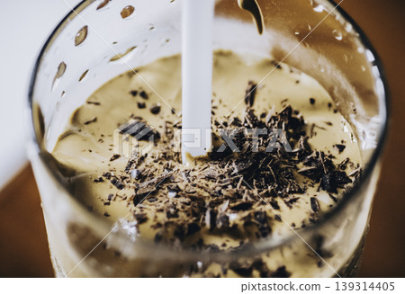 home made Dalgona coffee glass with straw macro photo home made Dalgona coffee glass with straw macro photo 139314405