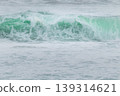 Tides crashing and splashing nice clear blue water in the Indian ocean. 139314621