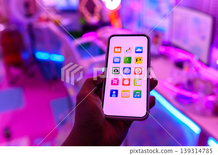 Hands used to operate the smartphone app screen Hands used to operate the smartphone app screen 139314785