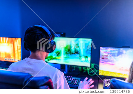 Gamers wear headphones Gamers wear headphones 139314786