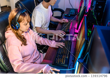 Two gamers play against each other on PC. Two gamers play against each other on PC. 139314796