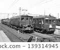 A freight train pulled by an ED16 locomotive awaiting departure. 139314945