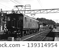 A freight train pulled by an ED16 locomotive awaiting departure. 139314954