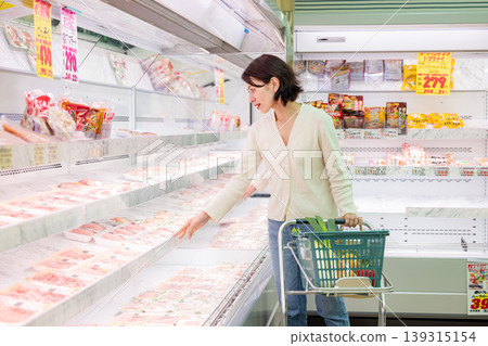 Female shopper buying meat at the supermarket Female shopper buying meat at the supermarket 139315154