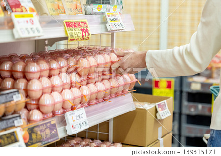 Woman buying eggs Woman buying eggs 139315171
