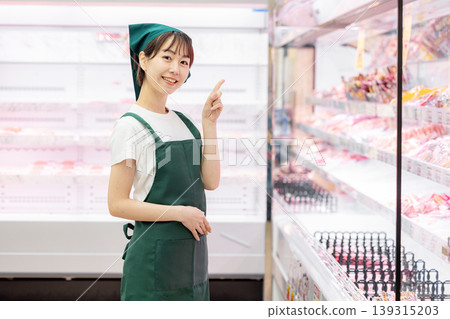 Female working in a supermarket Female working in a supermarket 139315203
