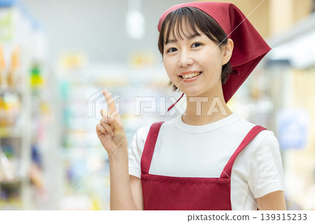Female working in a supermarket Female working in a supermarket 139315233