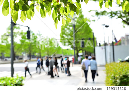 People walking through Marunouchi, surrounded by fresh greenery. People walking through Marunouchi, surrounded by fresh greenery. 139315828