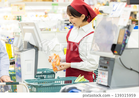 Female working in a supermarket 139315959