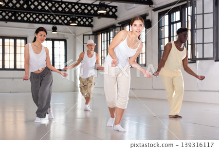 Four dancers exercising swing movements 139316117