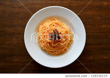 Tarako pasta with a table background viewed from directly above. Tarako pasta with a table background viewed from directly above. 139316133