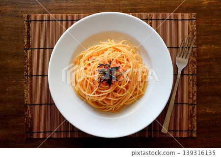 Tarako pasta with a table background viewed from directly above. Tarako pasta with a table background viewed from directly above. 139316135